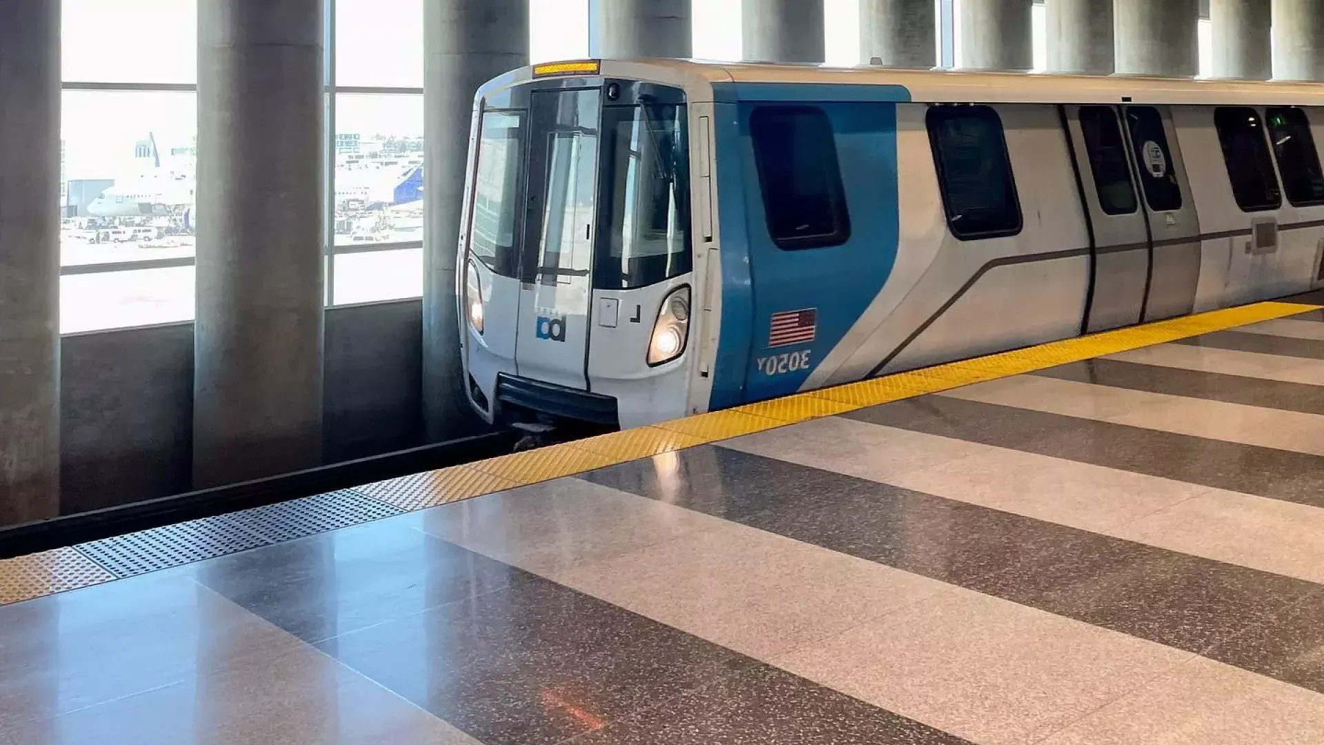 A BART train waits for passengers at the station.